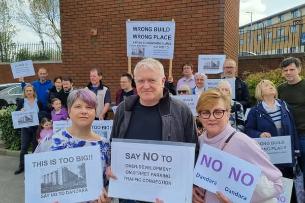 Protestors gather at the clock tower in the East Didsbury Tesco car park where the Blackbird Yard development is planned. Credit: Andrew Simcock