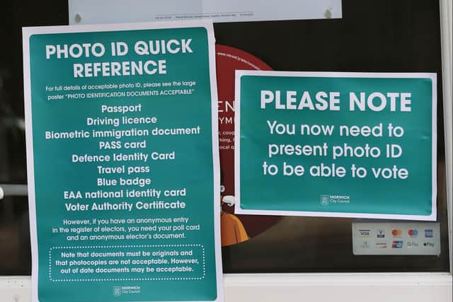 A sign at the local election reminding voters they need to bring ID. Photo: Getty Images