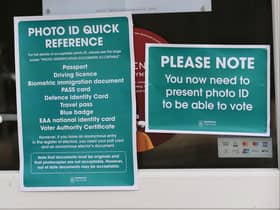 A sign at the local election reminding voters they need to bring ID. Photo: Getty Images