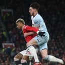  Marcus Rashford of Manchester United in action with Declan Rice of West Ham United during the Premier League match between Manchester United and West Ham United at Old Trafford on January 22, 2022 in Manchester, England. (Photo by Matthew Peters/Manchester United via Getty Images)