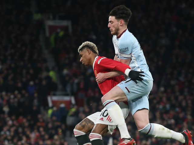  Marcus Rashford of Manchester United in action with Declan Rice of West Ham United during the Premier League match between Manchester United and West Ham United at Old Trafford on January 22, 2022 in Manchester, England. (Photo by Matthew Peters/Manchester United via Getty Images)