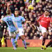 Nathan Ake of Manchester City and Marcus Rashford of Manchester United battle for the ball