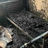 The blackened remains of the flat in Salford following the fire which was caused by an electric bike battery. Photo: GMFRS