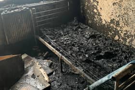 The blackened remains of the flat in Salford following the fire which was caused by an electric bike battery. Photo: GMFRS