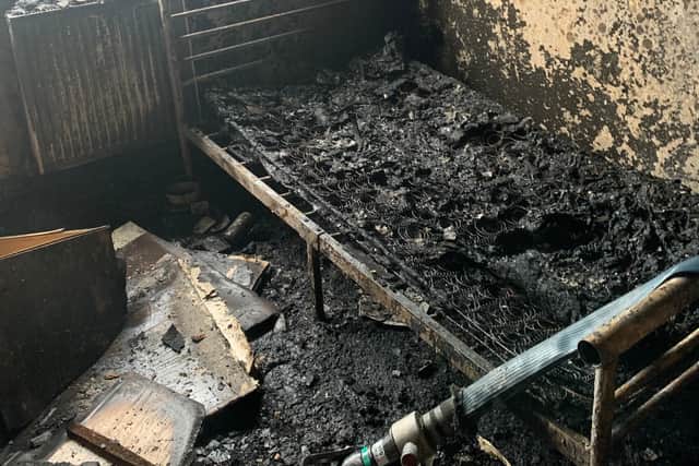 The blackened remains of the flat in Salford following the fire which was caused by an electric bike battery. Photo: GMFRS