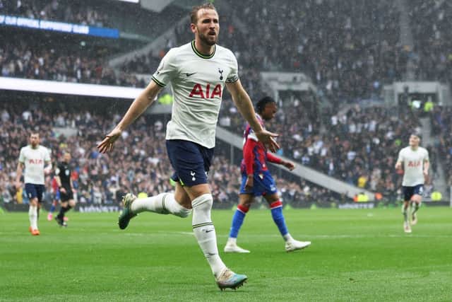 Tottenham Hotspur’s English striker Harry Kane (C) celebrates scoring his team’s first goal during the English Premier League  (Photo by ISABEL INFANTES/AFP via Getty Images)
