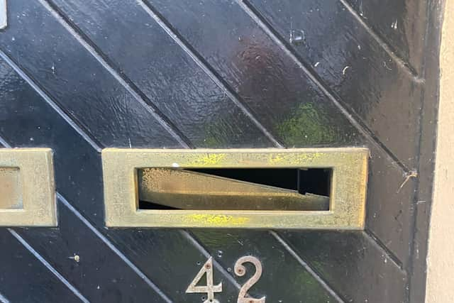 A broken letterbox on the Canterbury Gardens estate