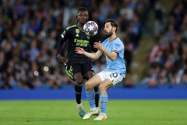 Bernardo Silva of Manchester City is challenged by Eduardo Camavinga of Real Madrid 