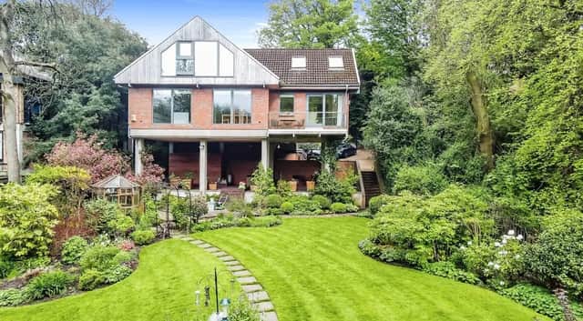 The property has a stunning garden and is raised on stilts for even more spectacular view