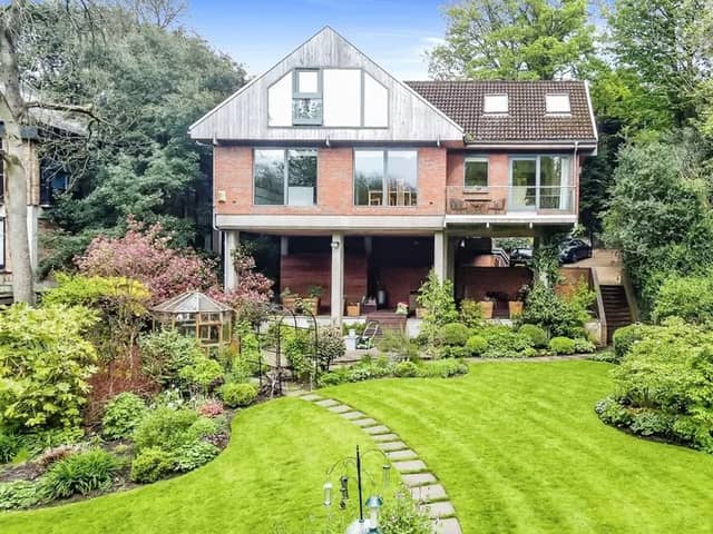 The property has a stunning garden and is raised on stilts for even more spectacular view