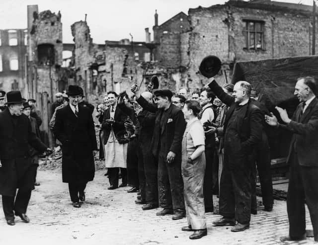 Sir Winston Churchill is greeted by a crowd during a visit to a bomb damaged area of Manchester. (Photo by Keystone/Getty Images)