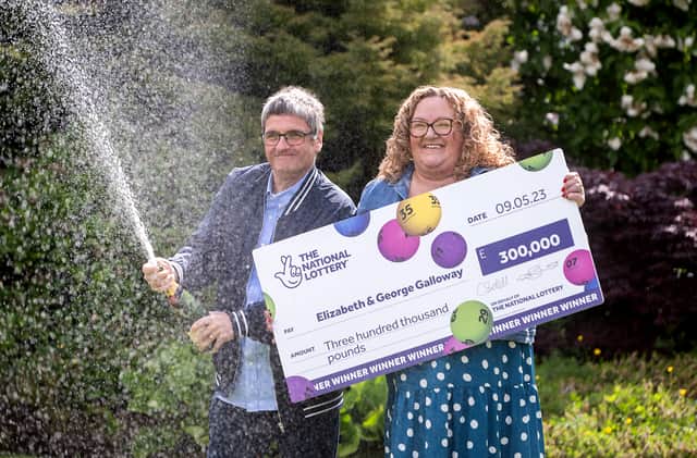 National Lottery winners Liz and George Galloway celebrate after winning £300,000 on the National Lottery Bingo Bonus Scratch card in Glasgow. (Photo: Anthony Devlin)