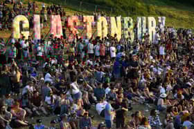 Festivalgoers attend the Glastonbury festival near the village of Pilton in Somerset, southwest England, on June 22, 2022. - (Photo by Andy Buchanan / AFP) (Photo by ANDY BUCHANAN/AFP via Getty Images)