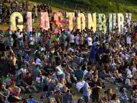Festivalgoers attend the Glastonbury festival near the village of Pilton in Somerset, southwest England, on June 22, 2022. - (Photo by Andy Buchanan / AFP) (Photo by ANDY BUCHANAN/AFP via Getty Images)