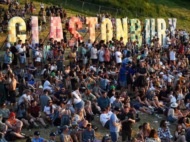 Festivalgoers attend the Glastonbury festival near the village of Pilton in Somerset, southwest England, on June 22, 2022. - (Photo by Andy Buchanan / AFP) (Photo by ANDY BUCHANAN/AFP via Getty Images)