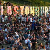 Festivalgoers attend the Glastonbury festival near the village of Pilton in Somerset, southwest England, on June 22, 2022. - (Photo by Andy Buchanan / AFP) (Photo by ANDY BUCHANAN/AFP via Getty Images)