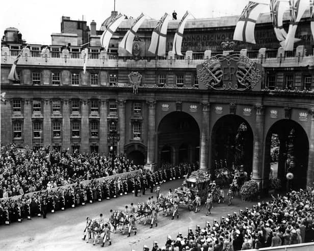 Queen Elizabeth II Coronation carriage and procession coming through Admiralty Arch on the way from Westminster Abbey to Buckingham Palace