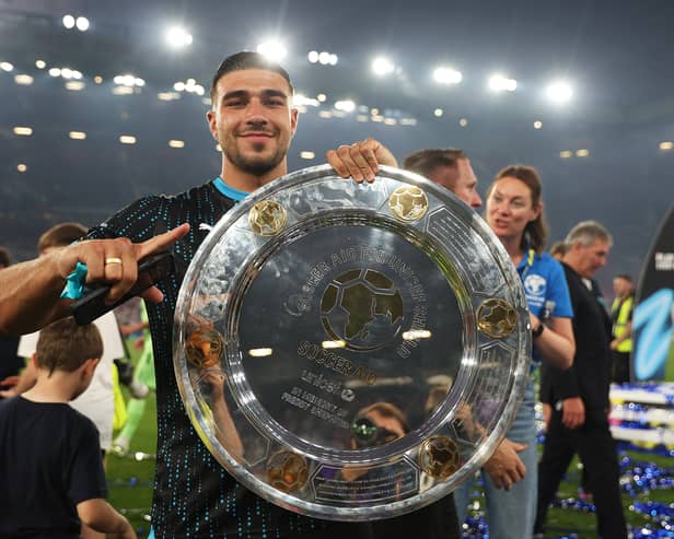Tommy Fury of World XI celebrates with the Soccer Aid winners shield following Soccer Aid for Unicef 2023 at Old Trafford on June 11, 2023 in Manchester, England. (Photo by Matt McNulty/Getty Images)