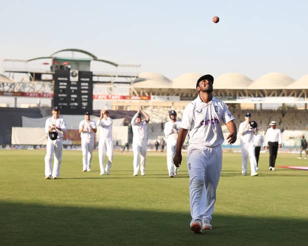 Rehan Ahmed of England walks off, after becoming the youngest debutant in men's Test history to take a five-for during day three of the Third Test between Pakistan and England at Karachi National Stadium on December 19, 2022 in Karachi, Pakistan. (Photo by Matthew Lewis/Getty Images)