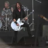 Foo Fighters' Dave Grohl (C), Josh Freese (C), Nate Lendel, performing as The Churnups, play on the Pyramid Stage on day 3 of the Glastonbury festival in the village of Pilton in Somerset, southwest England, on June 23, 2023. The festival takes place from June 21 to June 26. (Photo by Oli SCARFF / AFP) (Photo by OLI SCARFF/AFP via Getty Images)