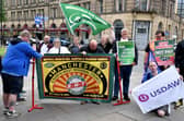 Members of the RMT stand on a picket line outside Manchester Victoria train station during the national rail strike over pay on August 18, 2022 in Manchester, England. (Photo by Anthony Devlin/Getty Images)