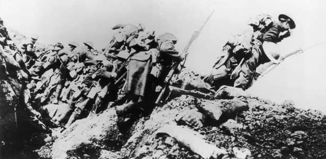 1st July 1916: British troops climbing from their trench on the first day of 'The Big Push' on the Somme during World War I. (Photo by Morgan-Wells/Hulton Archive/Getty Images)