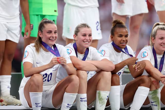Nikita Parris celebrates England's Euro 2022 win with Ella Toone, Alessia Russo and Lauren Hemp. Cr: Getty Images
