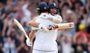 Chris Woakes of England celebrates with teammate Mark Wood after hitting the winning runs to win the LV= Insurance Ashes 3rd Test Match between England and Australia at Headingley on July 09, 2023 in Leeds, England. (Photo by Stu Forster/Getty Images)