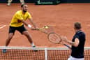 Robert Farah of Colombia returns a shot against Dan Evans of Great Britain during the doubles match as part of Round 1 of Qualifiers of Davis Cup 2023 at Pueblo Viejo Country Club on February 04, 2023 in Cota, Colombia. (Photo by Guillermo Legaria/Getty Images