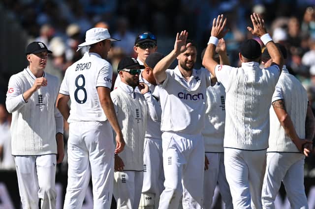 England's Chris Woakes (C) celebrates with teammates after taking the wicket of Australia's Cameron Green on the opening day of the fourth Ashes cricket Test match between England and Australia at Old Trafford cricket ground in Manchester, north-west England on July 19, 2023.