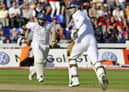 England batsmen Monty Panesar (L) and James Anderson (R) take runs from the Australia bowling as England salvages a draw on the final day of the first Ashes Test match in Cardiff, Wales, on July 12, 2009. AFP PHOTO/William WEST (Photo credit should read WILLIAM WEST/AFP via Getty Images)