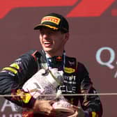 Max Verstappen holds the broken Hungarian Grand Prix trophy 
