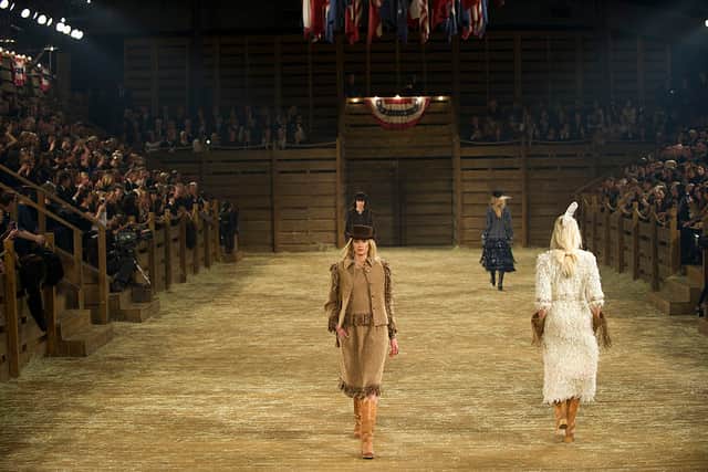 Models walk the runway during the Chanel "Metiers d'Art" Show  2013 in Dallas, Texas.  (Photo by Cooper Neill/Getty Images for Chanel)
