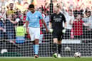 Aaron Ramsdale celebrates saving Rodri's penalty in the Community Shield shoot-out 