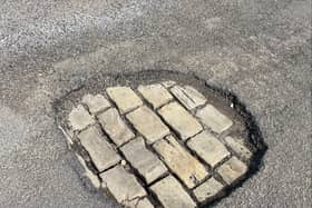 The large pothole outside my house 