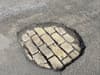 There are potholes all over my Manchester street - when will our embarrassing roads be sorted?