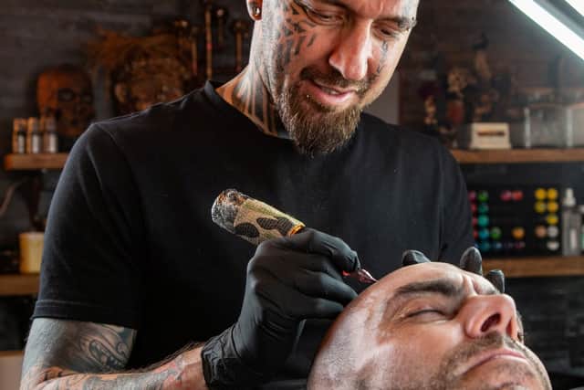 Dean Gunther goes to work on Anthony Donnellan's 'hair'. 