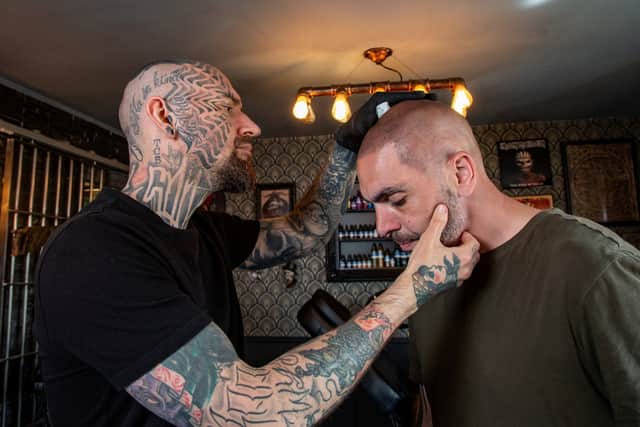 Dean Gunther checks his work on Anthony Donnellan's 'hair'. 