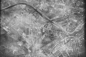 Salford, 30 May 1944. The USAAF collection has very few photographs of northern England. However, on 30 May 1944, a sortie recorded vertical views of places in and around Manchester. This view of Salford includes landmarks like the Manchester Ship Canal and Salford Docks. Bottom-right are Old Trafford football and cricket grounds and White City stadium. 