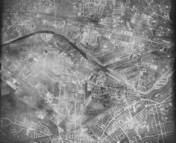 Salford, 30 May 1944. The USAAF collection has very few photographs of northern England. However, on 30 May 1944, a sortie recorded vertical views of places in and around Manchester. This view of Salford includes landmarks like the Manchester Ship Canal and Salford Docks. Bottom-right are Old Trafford football and cricket grounds and White City stadium. 