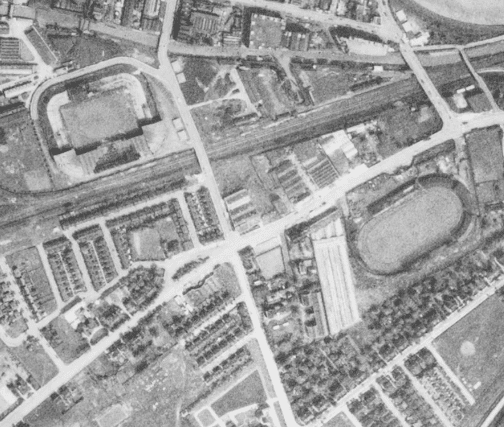 Detail showing Old Trafford football and cricket grounds and White City stadium, 30 May 1944. Old Trafford football ground was damaged during a bombing raid in March 1941 and was not used again for football until 1949. Damage to the roof of the main stand can be seen in this photograph. Source: Historic England Archive. USAAF Photography