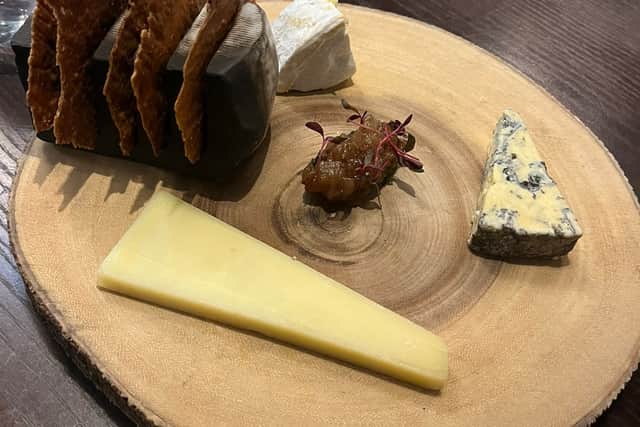A selection of cheeses with crackers and chutney 