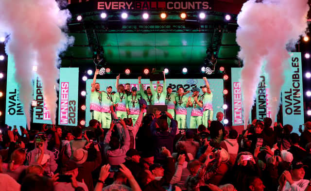 Sam Billings of Oval Invincibles lifts The Hundred Men's Champions Trophy as players of Oval Invincibles celebrate after defeating Manchester Originals during The Hundred Final between Oval Invincibles Men and Manchester Originals Men at Lord's Cricket Ground on August 27, 2023 in London, England. (Photo by Julian Finney/Getty Images)