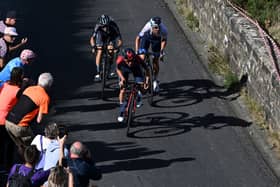 Team Ineos' British rider Tom Pidcock (C) leads the race during the fourth stage of the Tour of Britain 2022