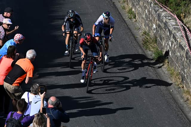 Team Ineos' British rider Tom Pidcock (C) leads the race during the fourth stage of the Tour of Britain 2022