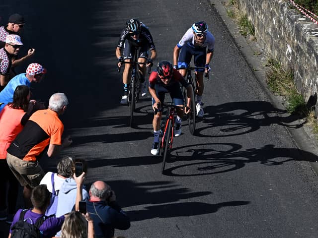 Team Ineos' British rider Tom Pidcock (C) leads the race during the fourth stage of the Tour of Britain 2022