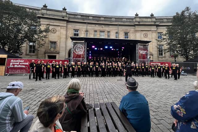 A rock choir performs at Bolton Food and Drink Festival 2023. 