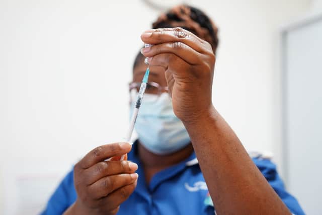 A nurse prepares a dose of a Covid-19 vaccine.