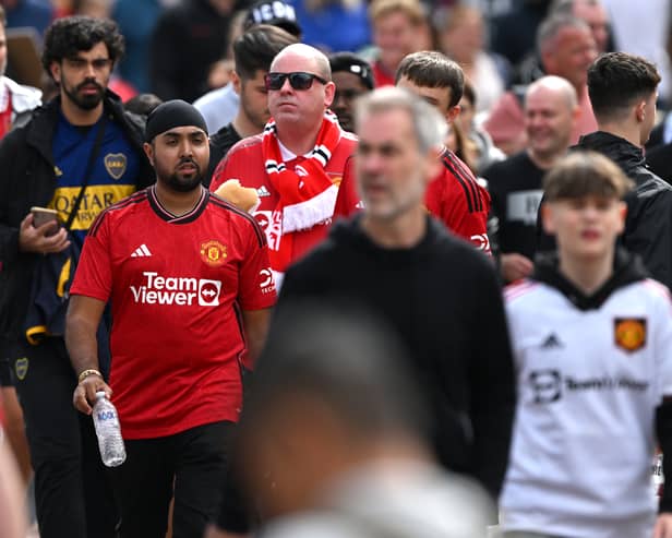 Manchester United fans arrive at Old Trafford (Image: Getty Images)