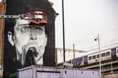 The iconic mural of the late Joy Division frontman Ian Curtis on the side of the Star & Garter pub 